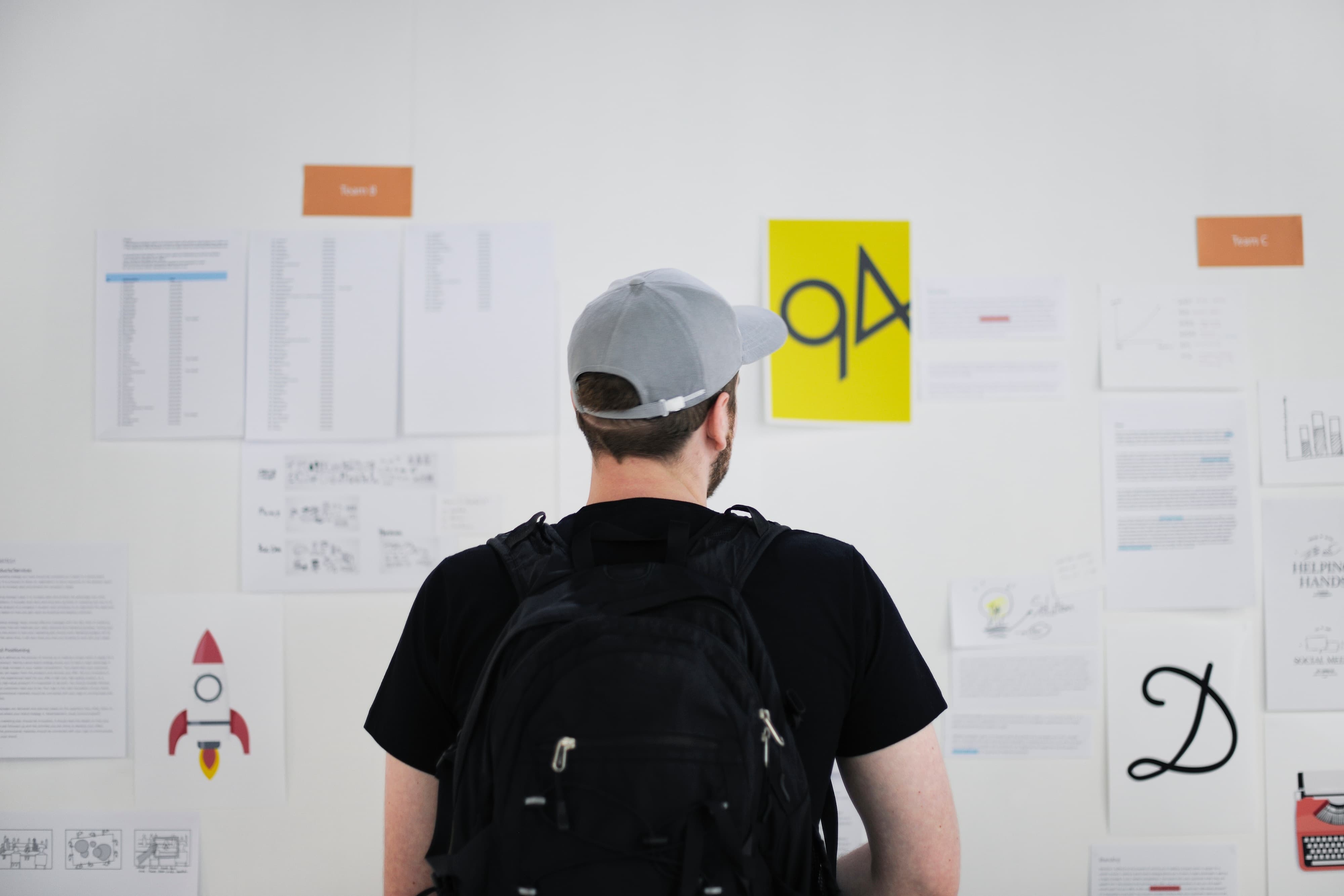 man looking over content and seo strategy on board